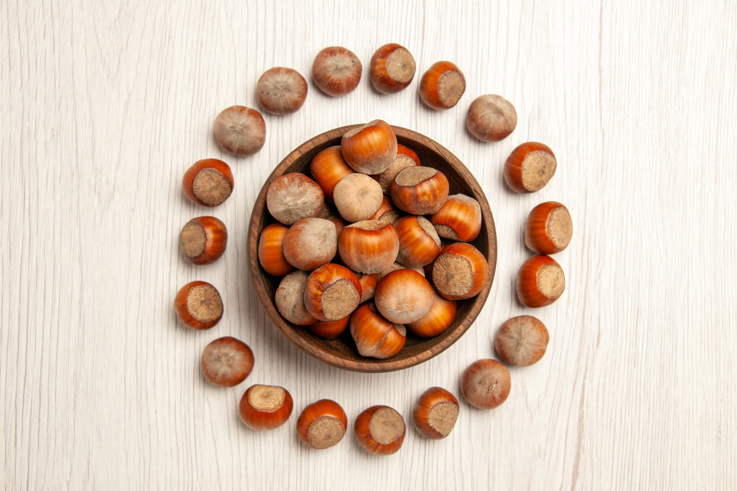 top-view-fresh-hazelnuts-white-desk-nut-snack-plant-walnut-peanut